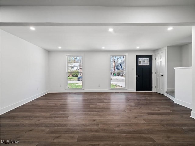 interior space featuring recessed lighting, baseboards, and dark wood-style floors