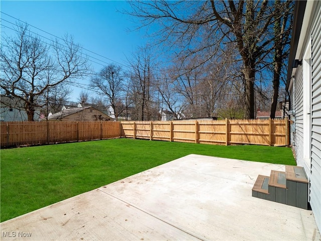 view of yard with a patio and a fenced backyard