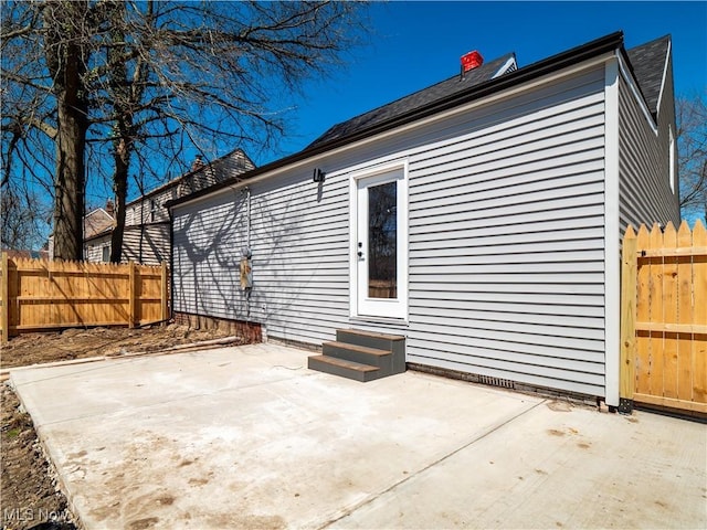 exterior space with fence, a patio, and entry steps