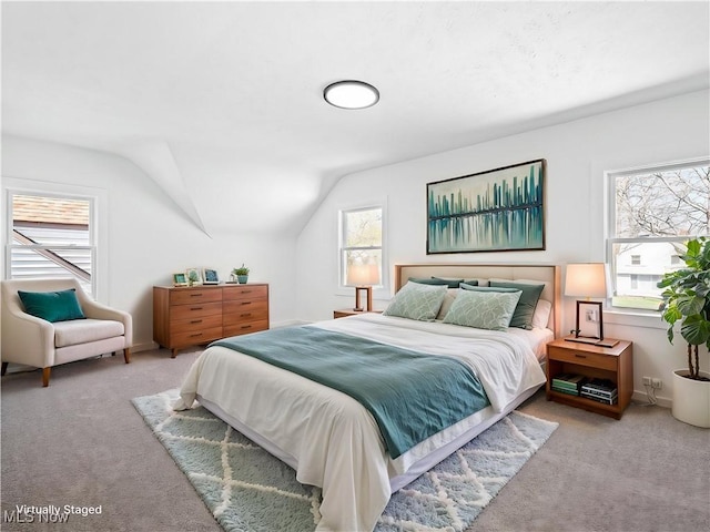 carpeted bedroom featuring vaulted ceiling