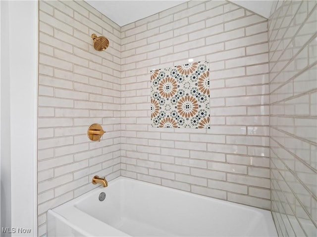bathroom with shower / tub combination