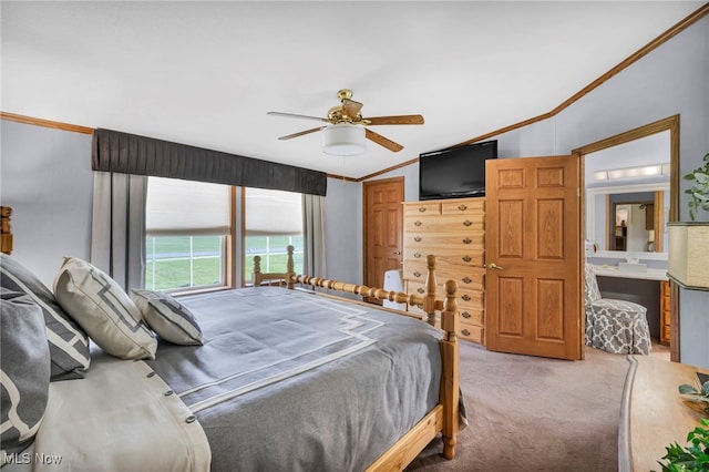 bedroom with crown molding, lofted ceiling, carpet flooring, and a ceiling fan