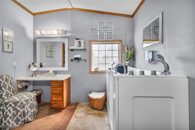 bathroom featuring vaulted ceiling, vanity, and ornamental molding
