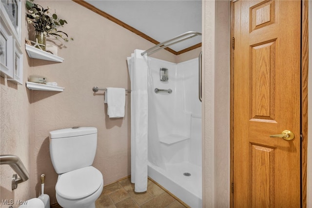 full bath with a shower stall and toilet