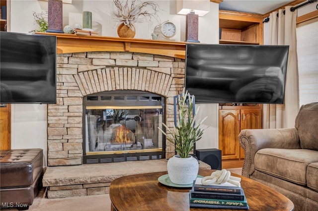 interior space with a stone fireplace