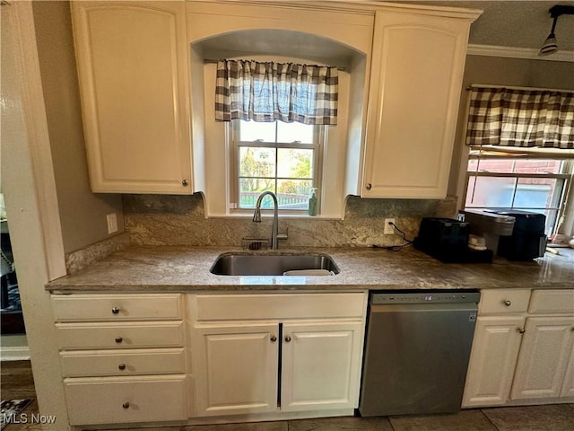 kitchen featuring a sink, dishwasher, white cabinetry, and a healthy amount of sunlight