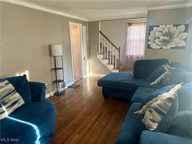 living room with baseboards, stairway, wood finished floors, and crown molding