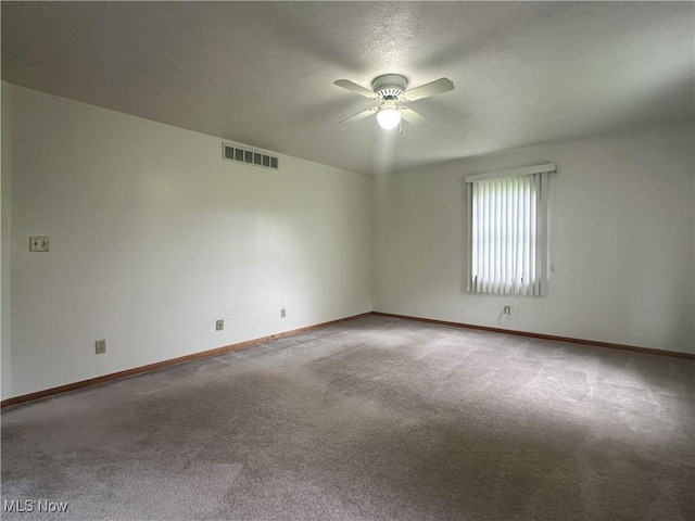 3799 Larchmont Ave NE, Bazetta, OH 44483 - unfurnished room with ceiling fan, carpet floors, and baseboards