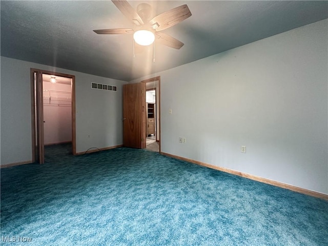 3799 Larchmont Ave NE, Bazetta, OH 44483 - carpeted empty room with a ceiling fan and baseboards