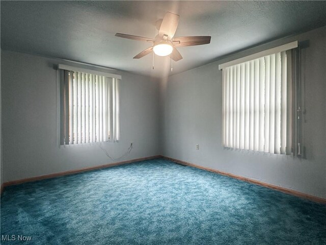 3799 Larchmont Ave NE, Bazetta, OH 44483 - unfurnished room with carpet flooring, a ceiling fan, baseboards, and a textured ceiling
