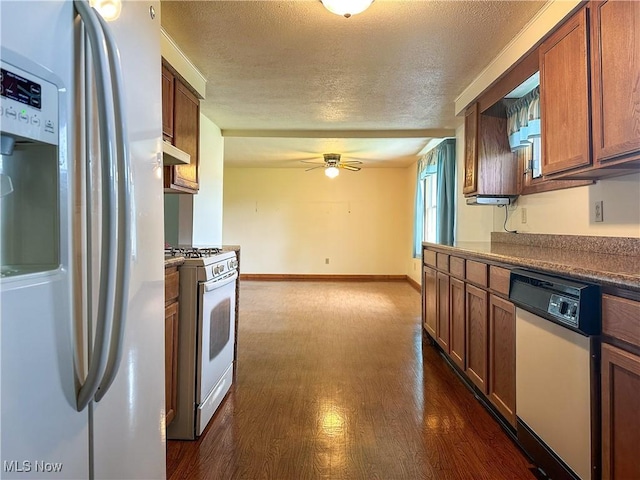3799 Larchmont Ave NE, Bazetta, OH 44483 - kitchen featuring white appliances, a textured ceiling, dark wood finished floors, ceiling fan, and under cabinet range hood