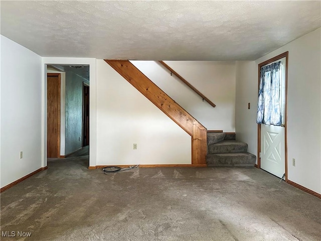 3799 Larchmont Ave NE, Bazetta, OH 44483 - unfurnished living room with stairway, carpet flooring, baseboards, and a textured ceiling