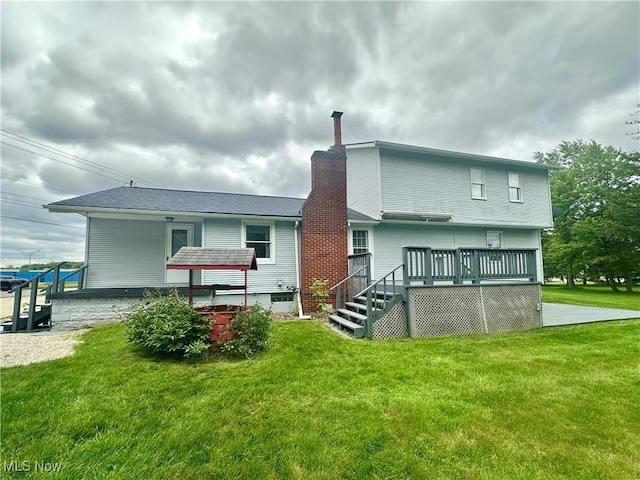 3799 Larchmont Ave NE, Bazetta, OH 44483 - rear view of property with a deck, a lawn, and a chimney