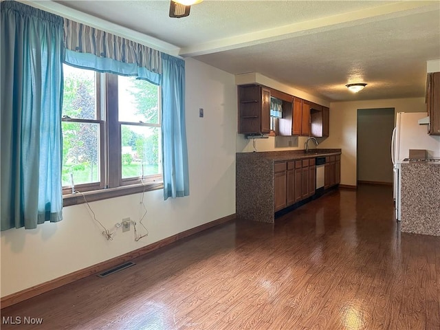 3799 Larchmont Ave NE, Bazetta, OH 44483 - kitchen with dark wood-style floors, baseboards, dishwasher, a textured ceiling, and open shelves