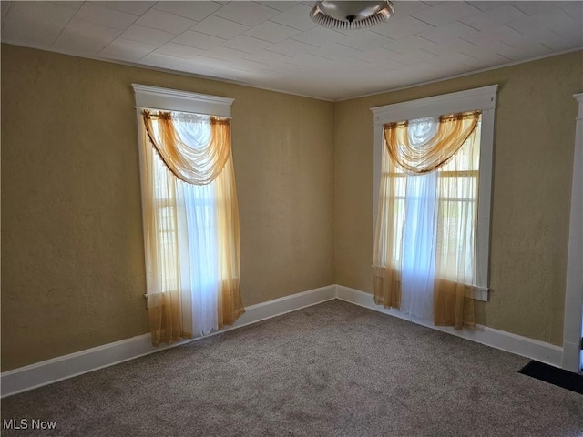 606 S 7th St, Cambridge, OH 43725 - spare room featuring healthy amount of natural light and carpet
