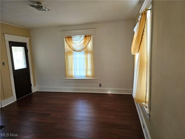 606 S 7th St, Cambridge, OH 43725 - entryway featuring wood finished floors, ornamental molding, and baseboards