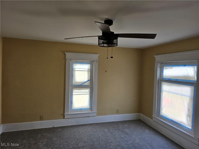606 S 7th St, Cambridge, OH 43725 - unfurnished room featuring ceiling fan, plenty of natural light, carpet floors, and baseboards