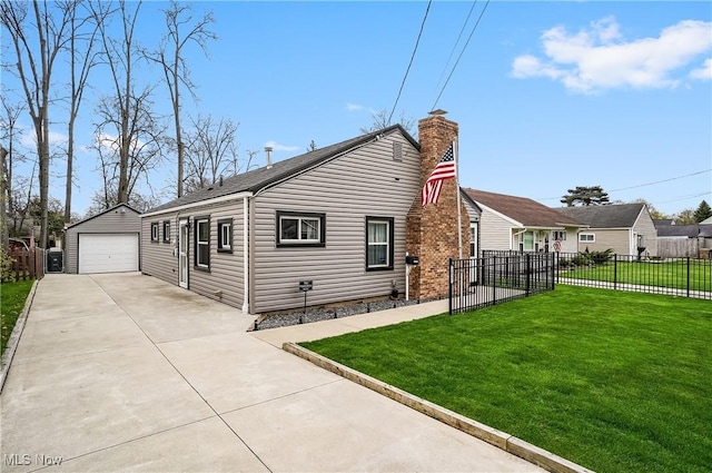 view of property exterior featuring concrete driveway, fence, an outbuilding, a yard, and a garage