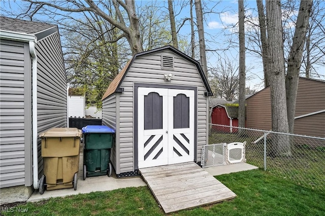 view of shed with fence