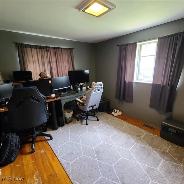 243 Hagan St, Adena, OH 43901 - home office featuring visible vents and wood finished floors