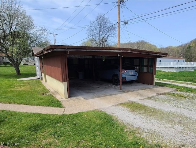 243 Hagan St, Adena, OH 43901 - view of car parking with driveway and a carport