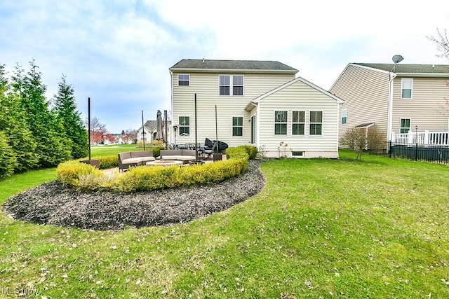 rear view of house featuring an outdoor living space, fence, a yard, and a patio