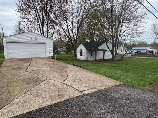 exterior space with an outbuilding and a detached garage