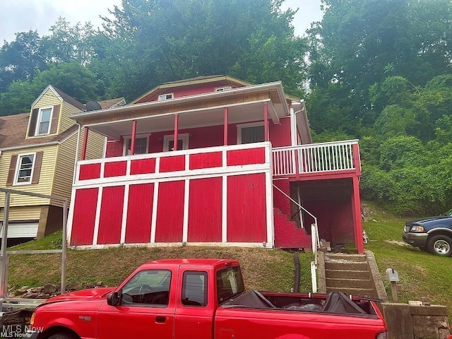 exterior space with a view of trees and stairs