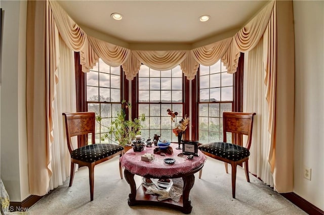 living area featuring light carpet, baseboards, and recessed lighting