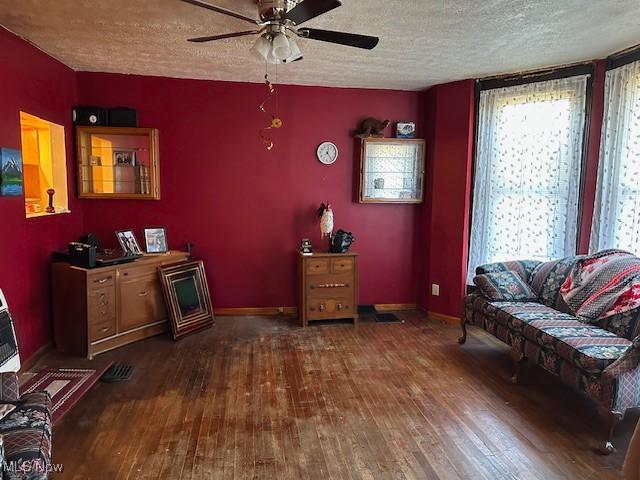 214 Jarvis St, Bowerston, OH 44695 - sitting room with ceiling fan, baseboards, a textured ceiling, and hardwood / wood-style floors