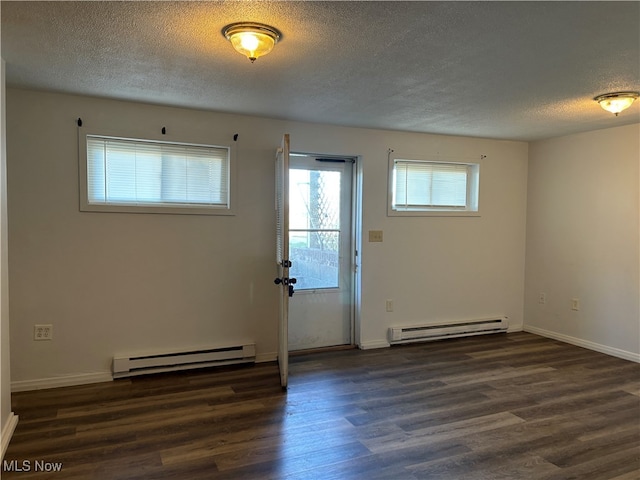 doorway to outside featuring a baseboard radiator, dark wood finished floors, a textured ceiling, and baseboards