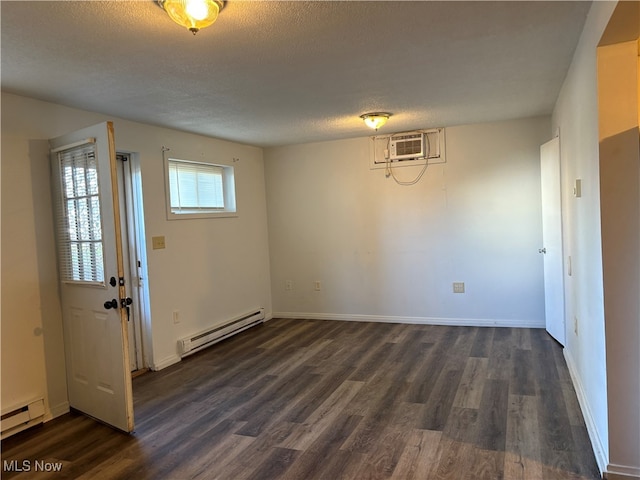 unfurnished dining area with a textured ceiling, dark wood-type flooring, and a baseboard radiator