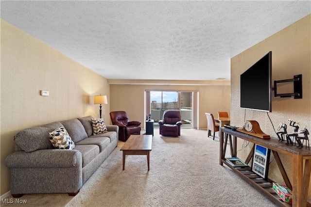 living room with carpet flooring and a textured ceiling