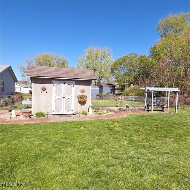view of shed featuring fence