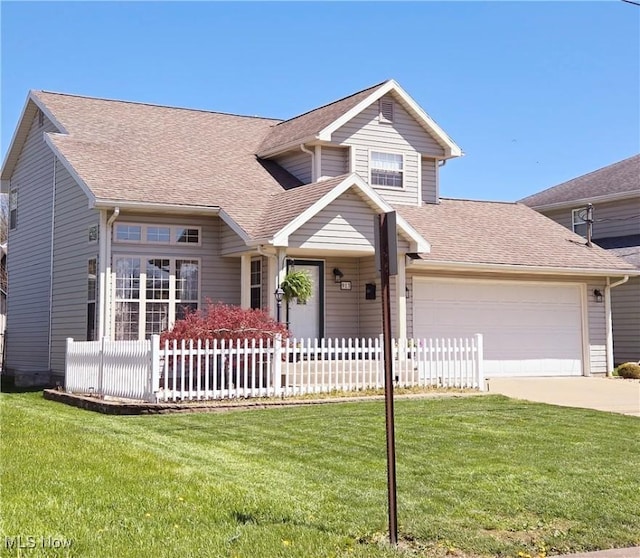 view of front of house featuring fence, a shingled roof, concrete driveway, an attached garage, and a front yard