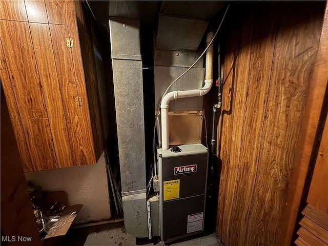 utility room featuring heating unit