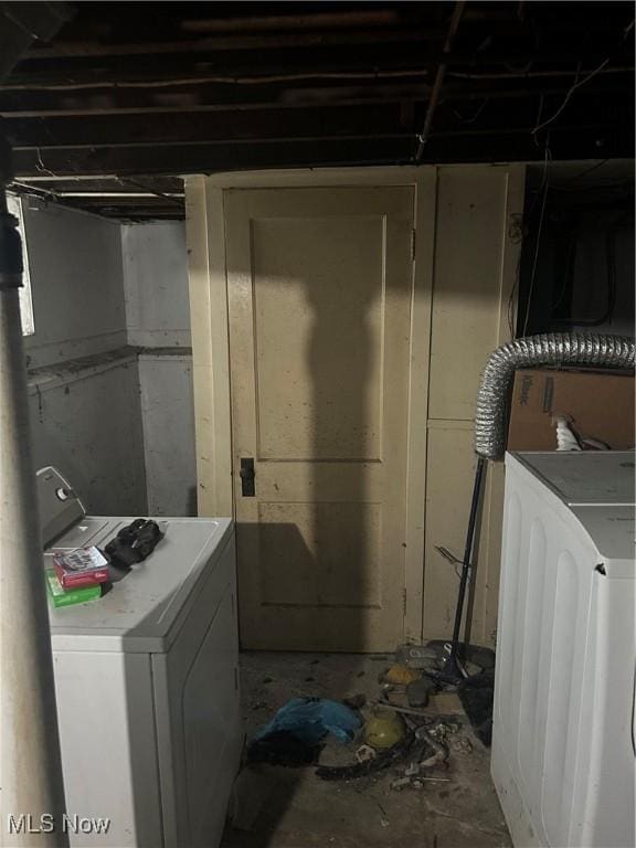 clothes washing area featuring laundry area and washer / clothes dryer