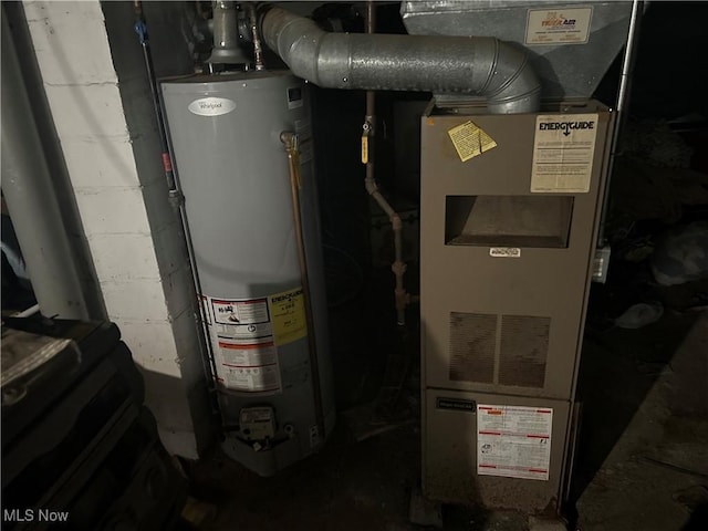 utility room featuring gas water heater