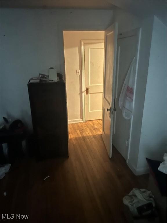 hall with wood finished floors