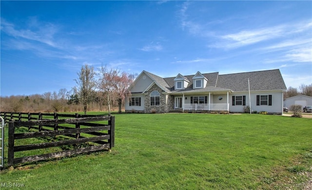 cape cod home with a front lawn, fence, and covered porch