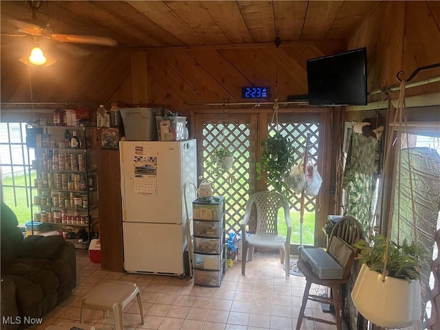 1166 Raymond St NW, Warren, OH 44485 - dining room featuring wood ceiling, light tile patterned floors, and wood walls