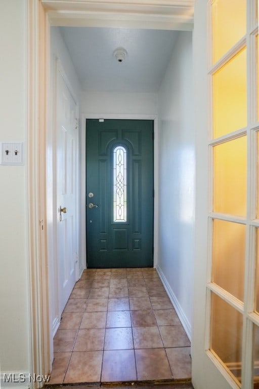 3867 E 177th St, Cleveland, OH 44128 - foyer with baseboards and light tile patterned floors