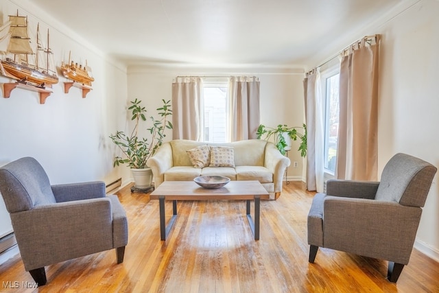 3867 E 177th St, Cleveland, OH 44128 - living area featuring light wood-type flooring, baseboard heating, and baseboards