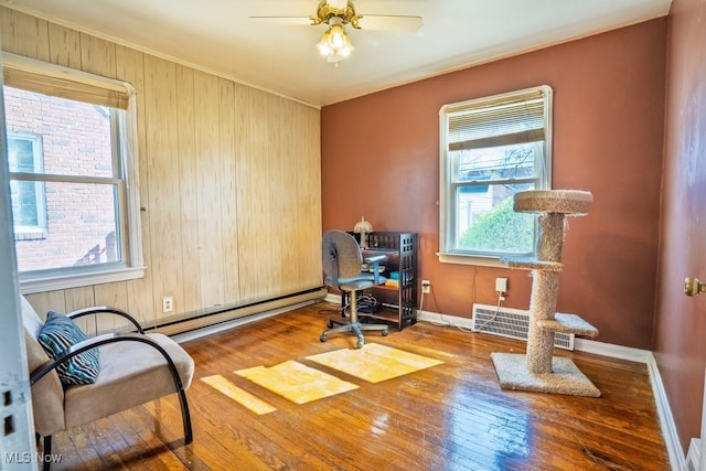 3867 E 177th St, Cleveland, OH 44128 - office featuring hardwood / wood-style flooring, a baseboard heating unit, ceiling fan, baseboards, and visible vents