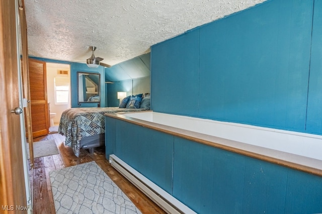3867 E 177th St, Cleveland, OH 44128 - bedroom featuring wood finished floors, a textured ceiling, and ceiling fan