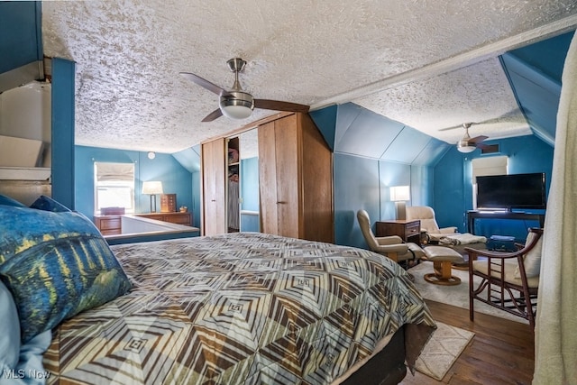 3867 E 177th St, Cleveland, OH 44128 - bedroom with lofted ceiling, a textured ceiling, ceiling fan, and wood finished floors