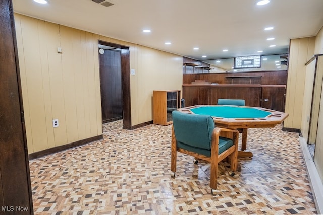 3867 E 177th St, Cleveland, OH 44128 - recreation room featuring baseboards, wood walls, a bar, and recessed lighting