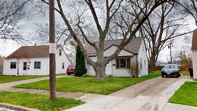 14513 Mission Rd, Cleveland, OH 44135 - new england style home featuring concrete driveway and a front lawn