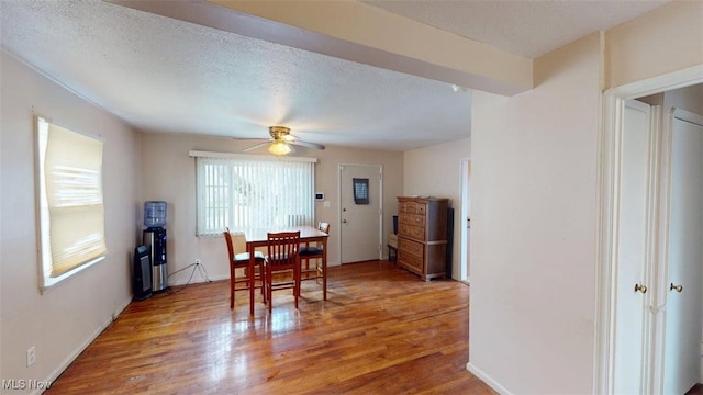 14513 Mission Rd, Cleveland, OH 44135 - dining area featuring baseboards, a ceiling fan, and light wood finished floors