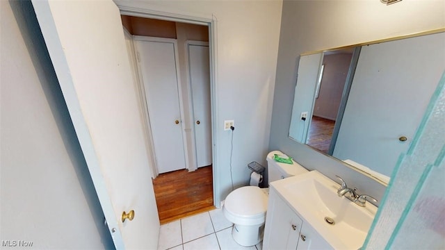 14513 Mission Rd, Cleveland, OH 44135 - half bathroom with vanity, toilet, and tile patterned flooring